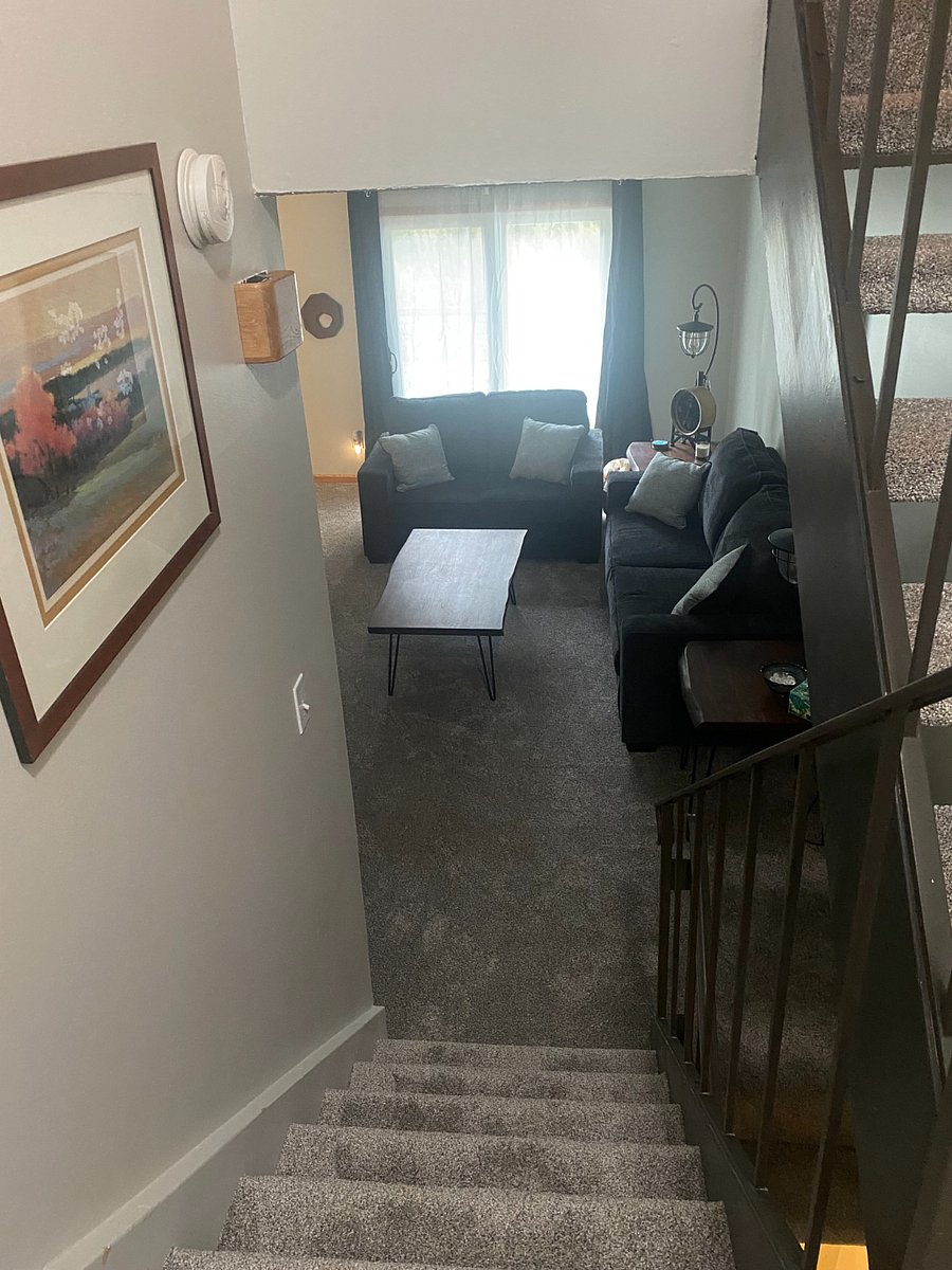 Stairs from second floor bedrooms to living room