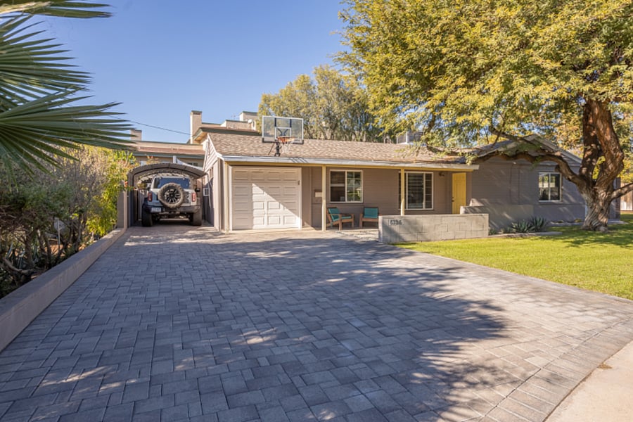 Larger paver driveway w/covered carport and shaded parking