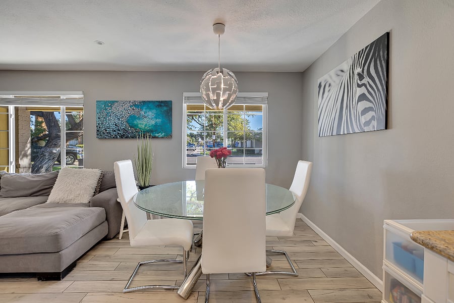 Dining area connecting the kitchen and living room with abundant natural light
