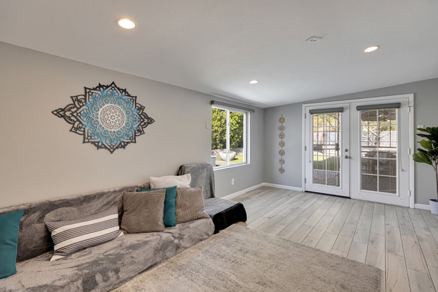 Arizona room off the kitchen 
w/contemporary decor, comfortable seating for lounging or sleeping, dedicated AC/heating unit, blackout shades and easy access to the backyard
