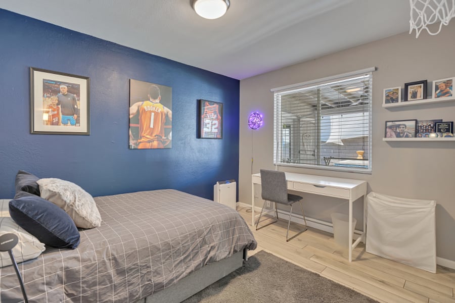 Third bedroom w/full-size bed and desk, suitable for use as a guest room or home office