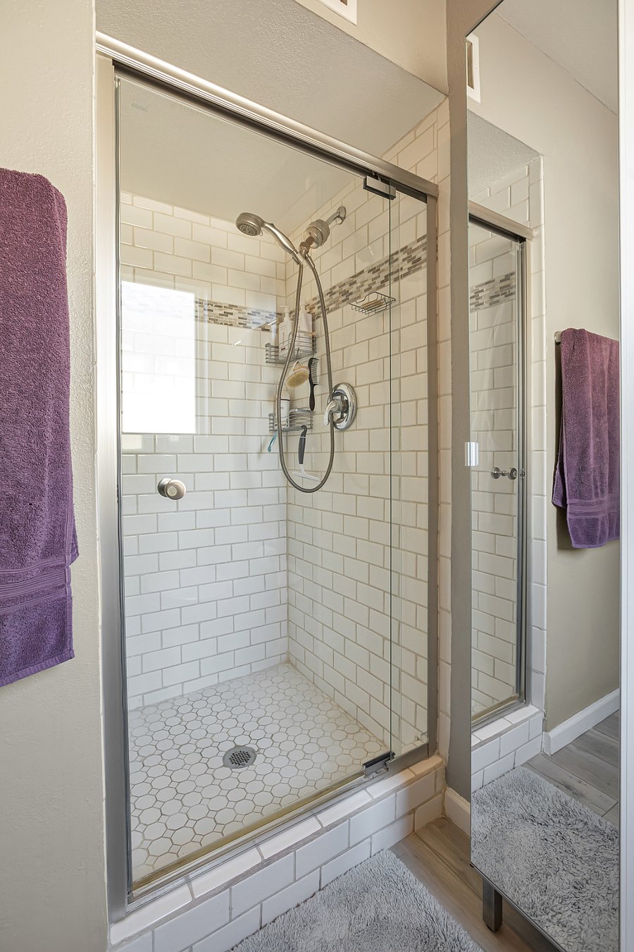 Primary bathroom with glass-enclosed shower
