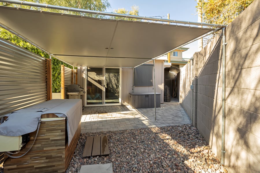 Additional view of the covered ice bath area with access to the modern shed and additional covered space for bikes or gear