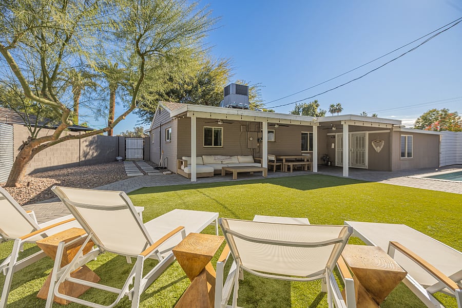 View from the sun loungers overlooking the covered patio and outdoor living area