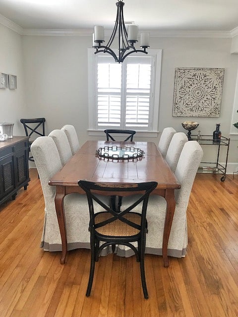 Seating for 6 with slip covered Arhaus Dining chairs and a large farmhouse dining table
