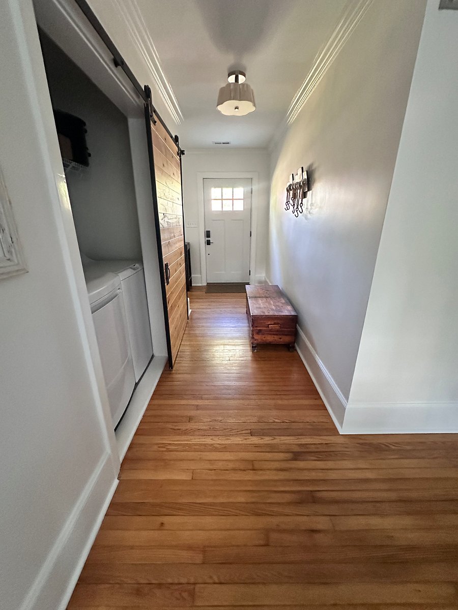 Washer/Dryer behind beautiful barn door