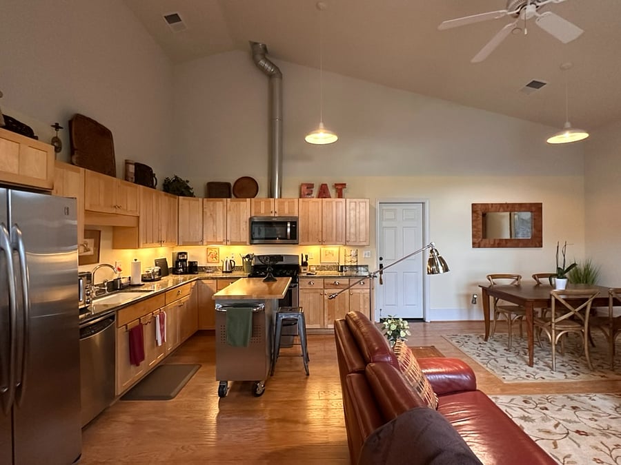 Kitchen with island has plenty of storage for personal items you may wish to bring from home. Cupboards contain the necessities for a fully equipped kitchen