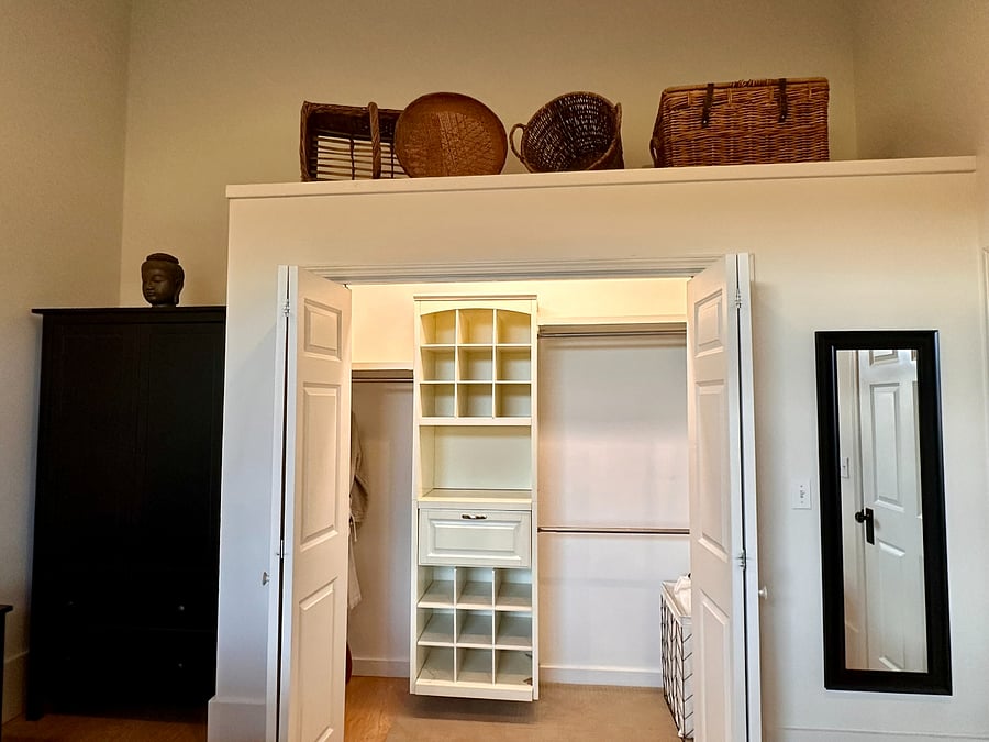 Closet organizer, luggage rack, robes and hangers.