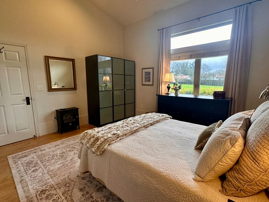 Electric stove for ambience, 3 section wardrobe, unobstructed view from window.