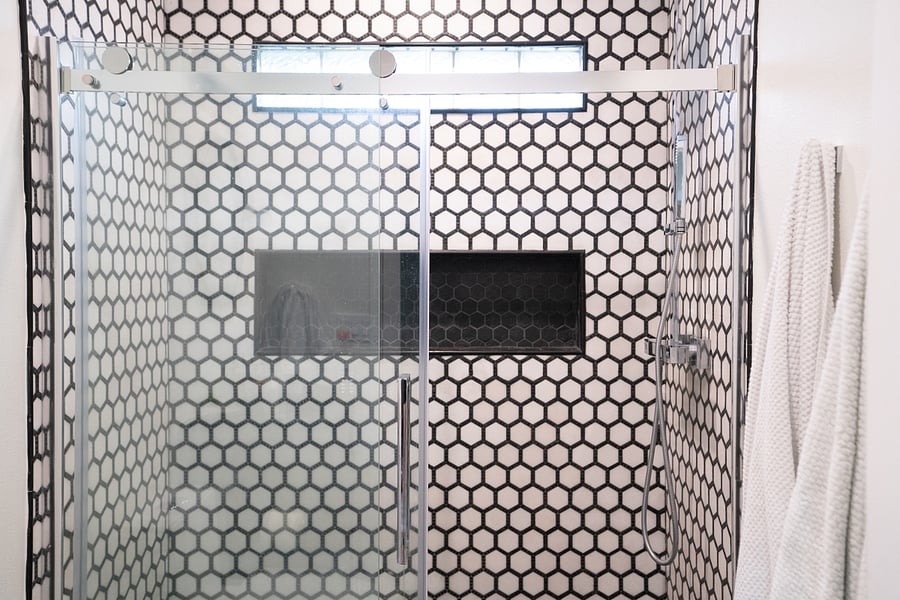Rain shower designed with textured floor tiles, no lip entry in our Ft Myers home.