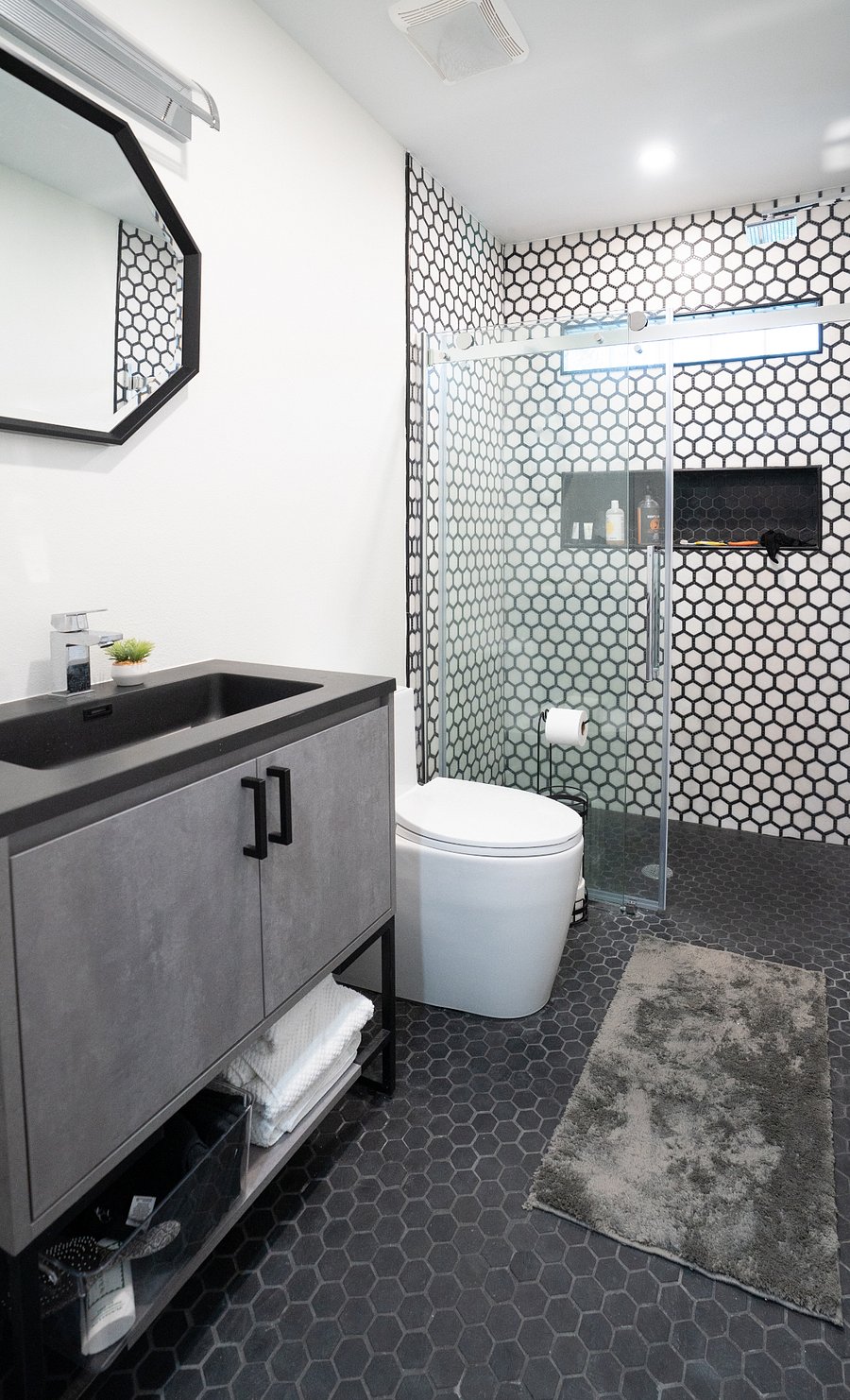 Bathroom was designed for impact! Textured tile floor. Fort Myers home.