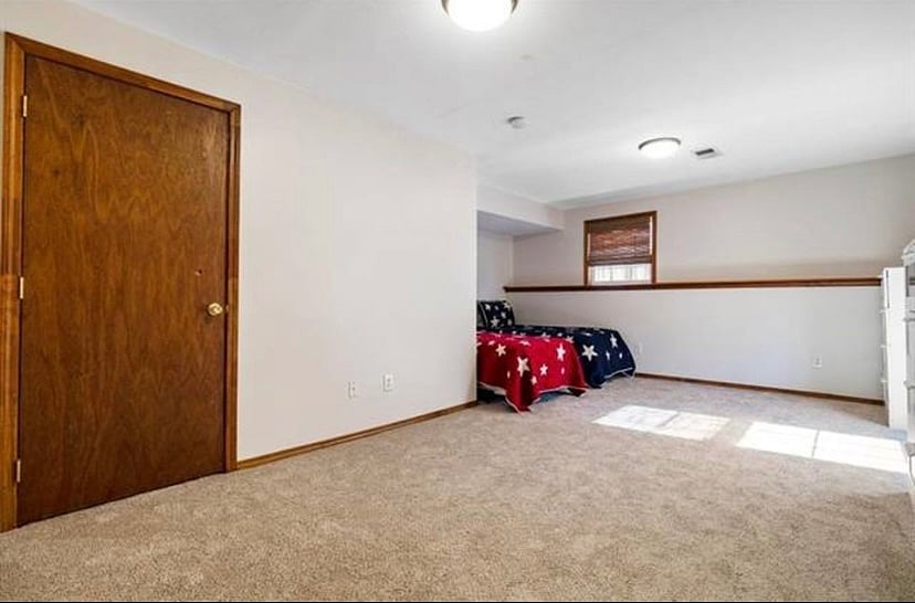 Downstairs xl bedroom-not updated yet. White trim and there is a Queen bed and full dresser and closet.