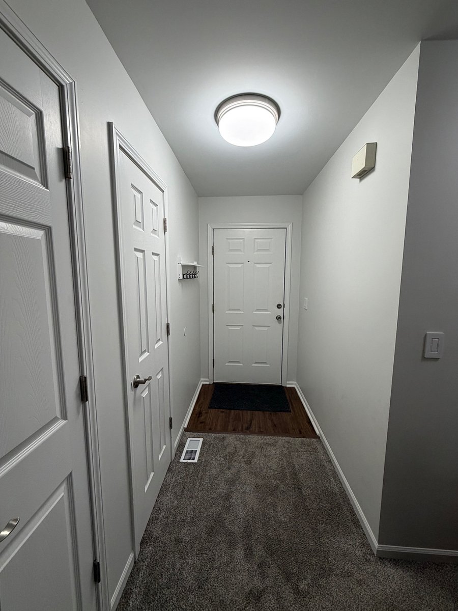 Front entryway with coat closet and hall closet
