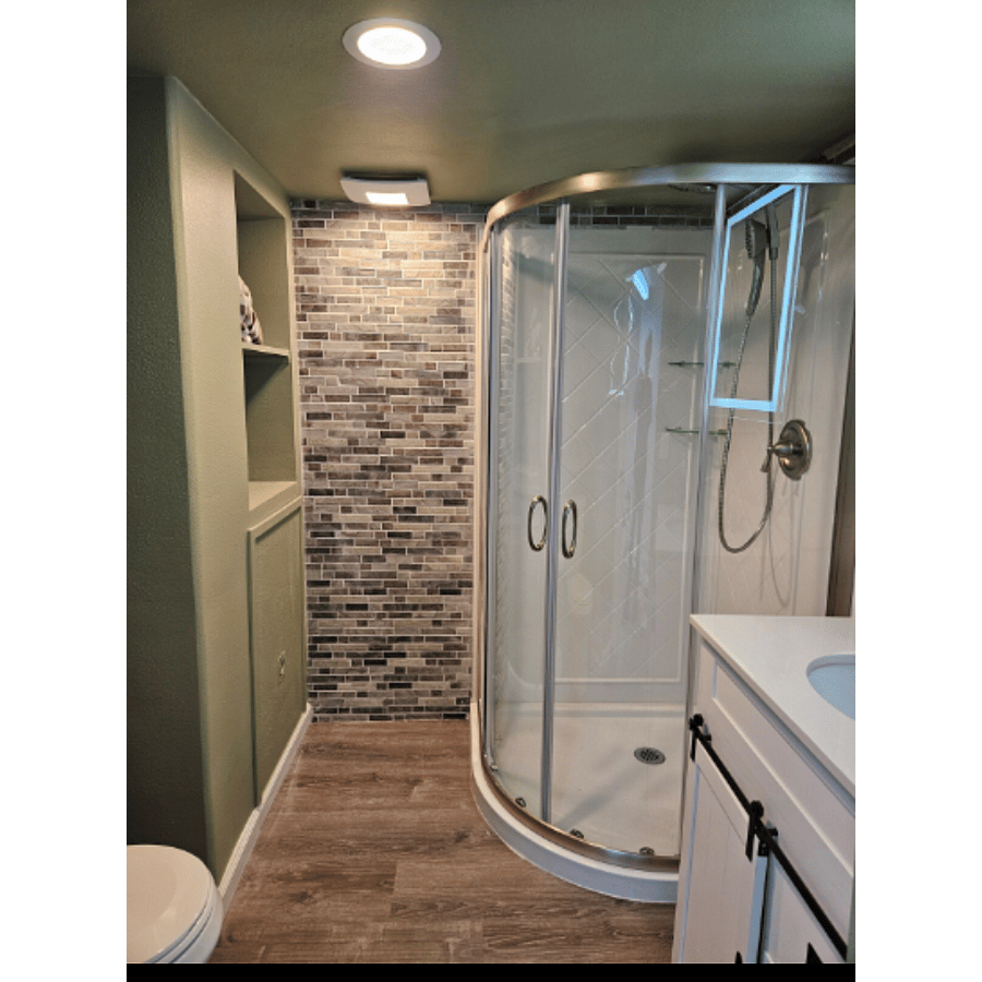 Bathroom. Continuous supply of hot water provided by tankless water heater.