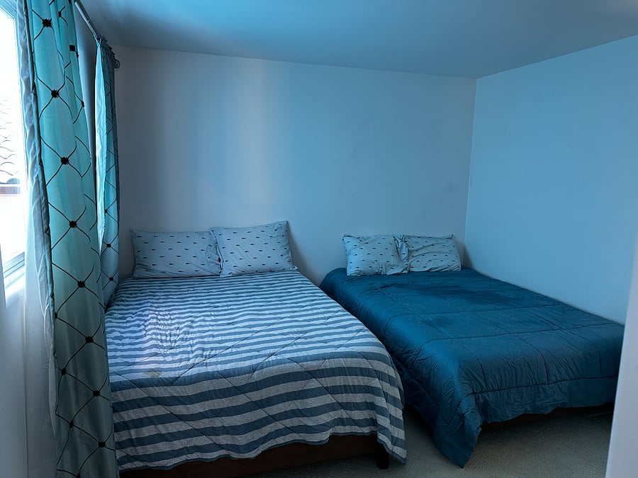 Third floor bedroom with two full size beds