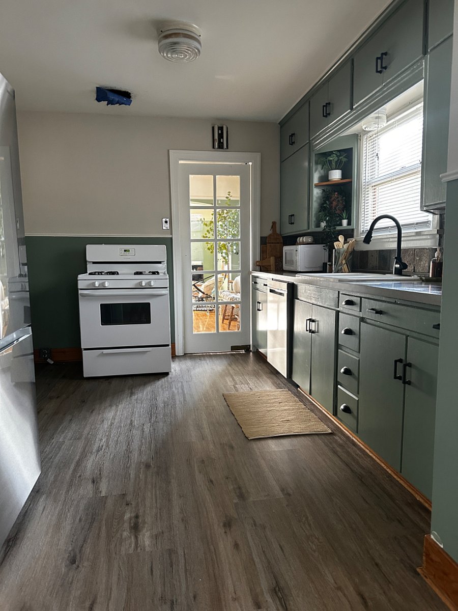 Main Floor - Kitchen Door Opens to Open Concept Dining/Living Room