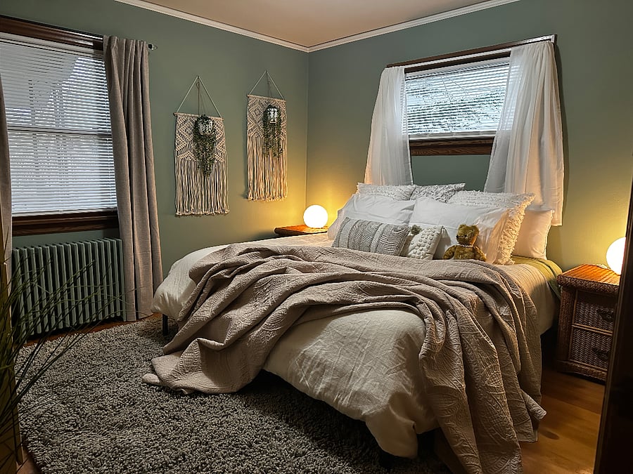 1st Bedroom on Main Floor - King Bed with dresser and reading chair - two windows.