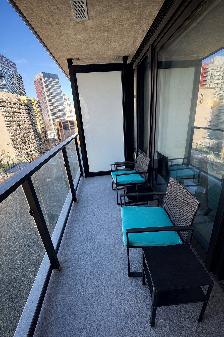 Spacious balcony with furniture overlooking Apple Orchard, views of downtown Seattle, Amazon Sphere, mountain and water view