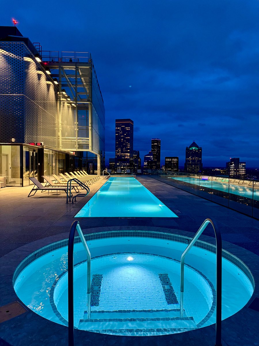 Spa at night with views of city lights 