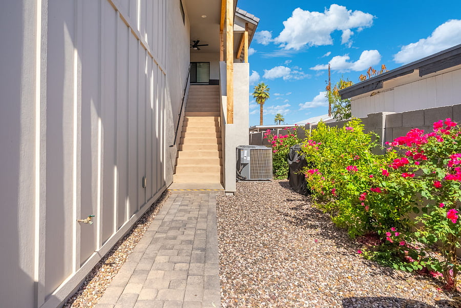 Your private path to relaxationcomplete with a flat, easy-to-walk paver stone path and vibrant landscaping leading to your front stairs.