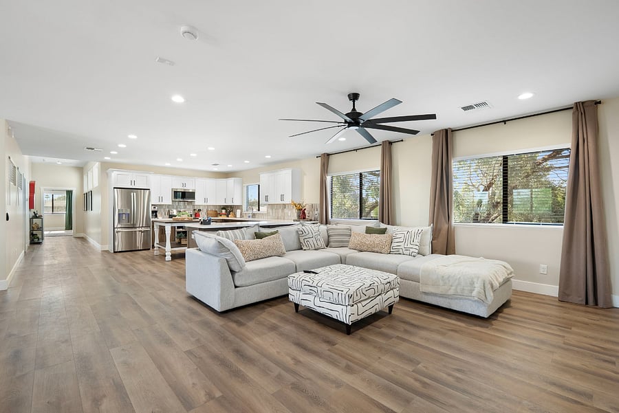 This beautifully bright and open-concept home features a seamless flow between the gourmet kitchen and a spacious, contemporary living area, perfect for group gatherings.