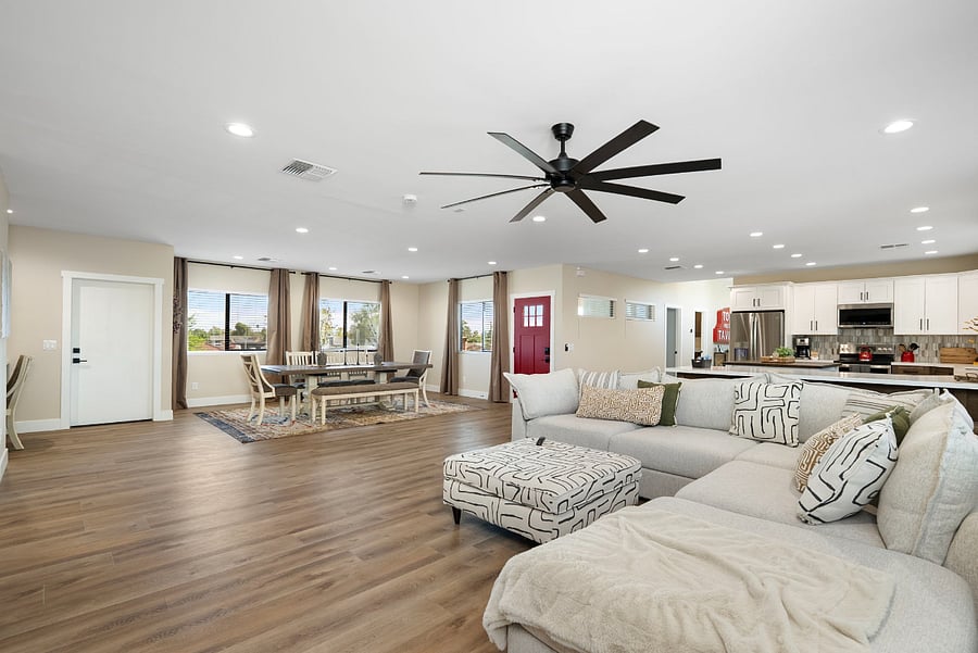 Relax, unwind, & stream your favorite shows in this massive, open-concept living area. Positioned at the heart of the home's sprawling great room, this inviting area is expertly designed to provide max comfort for movie nights or a casual afternoon.