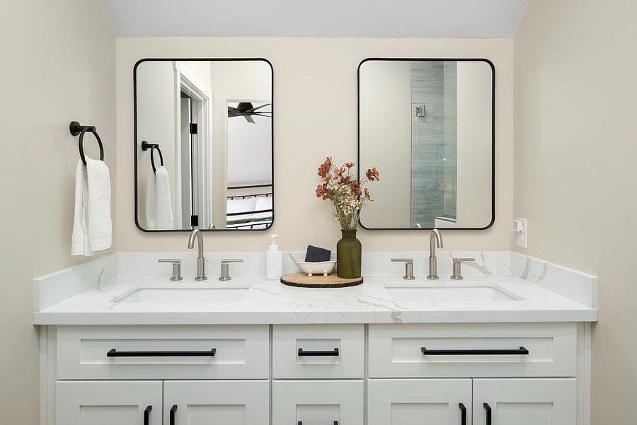 Speed up your morning routine in this beautifully designed modern bathroom station. Combining sleek contemporary fixtures with functional storage, this bright setup makes it easy for couples or friends to get ready simultaneously.