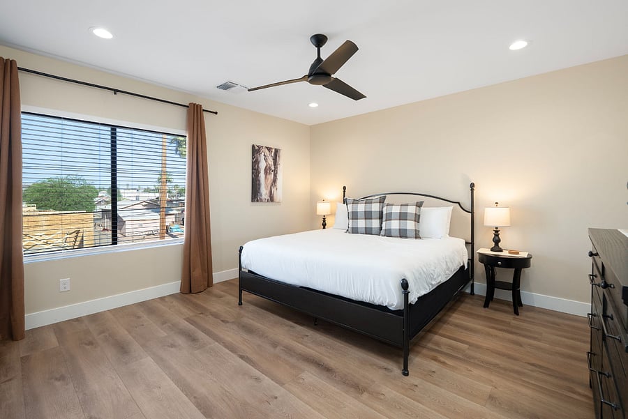 Enjoy a peaceful night's rest in this beautifully appointed secondary guest bedroom. Balancing modern farmhouse elements with serene neutral tones, this spacious room offers plenty of space to stretch out and unpack.