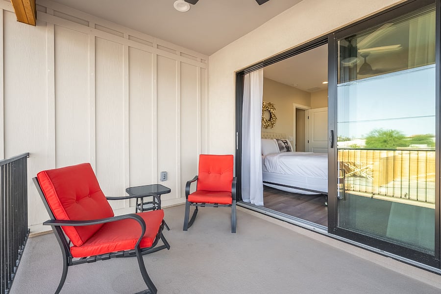 Step outside your bedroom and into your own private outdoor oasis. This covered second-floor balcony provides a peaceful, shaded retreat where you can sip your morning coffee, read a book, or watch the sunset in total comfort.