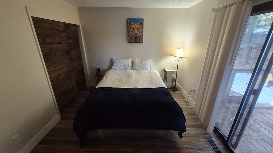 Downstairs Large Bedroom w/ covered patio