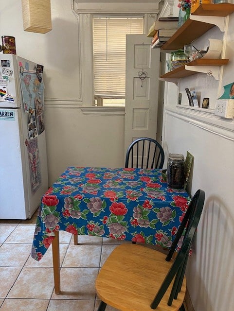 Fully equipped and organized shared kitchen with gas stove and full-sized refrigerator.