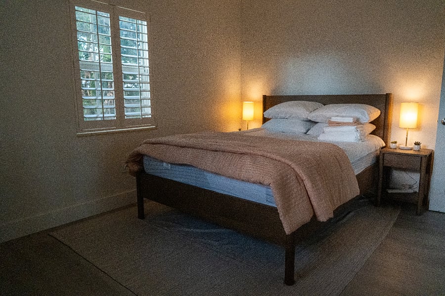 Secondary bedroom towards the back with a desk and a desk chair.
