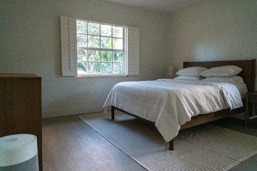 Primary bedroom towards the front with a dresser.