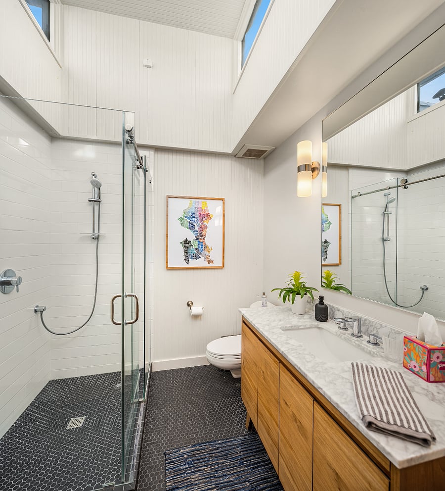 The second bathroom is bright, has heated floors and a walk in shower.