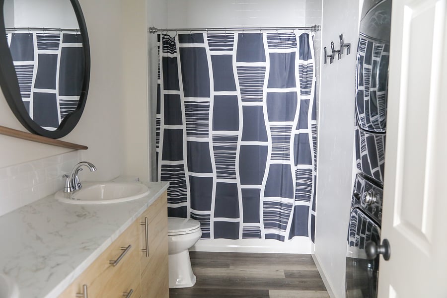 Bathroom with tub-shower combo.