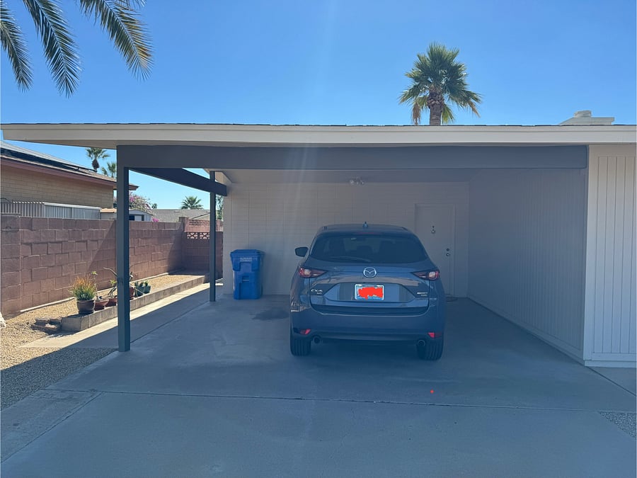 Two-car car port. Currently only one car using car port.