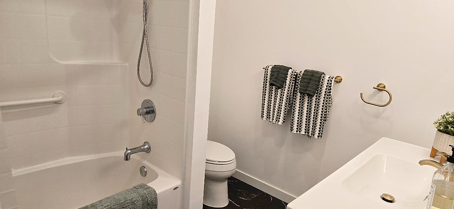 Bathroom with tub and shower