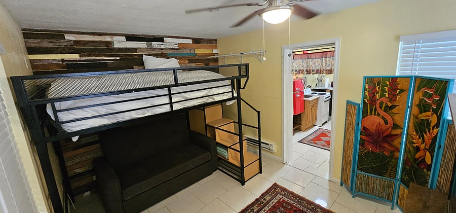 Queen size Loft bed with pull out sofa bed below if it was needed.