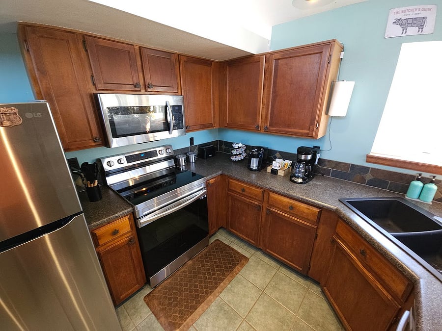 Toaster, cooking utensils, coffee and sugar