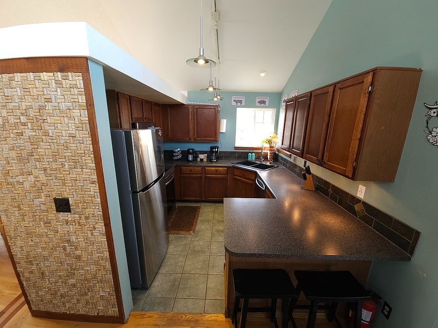 Kitchen with stove, full fridge/freezer, dishwasher,