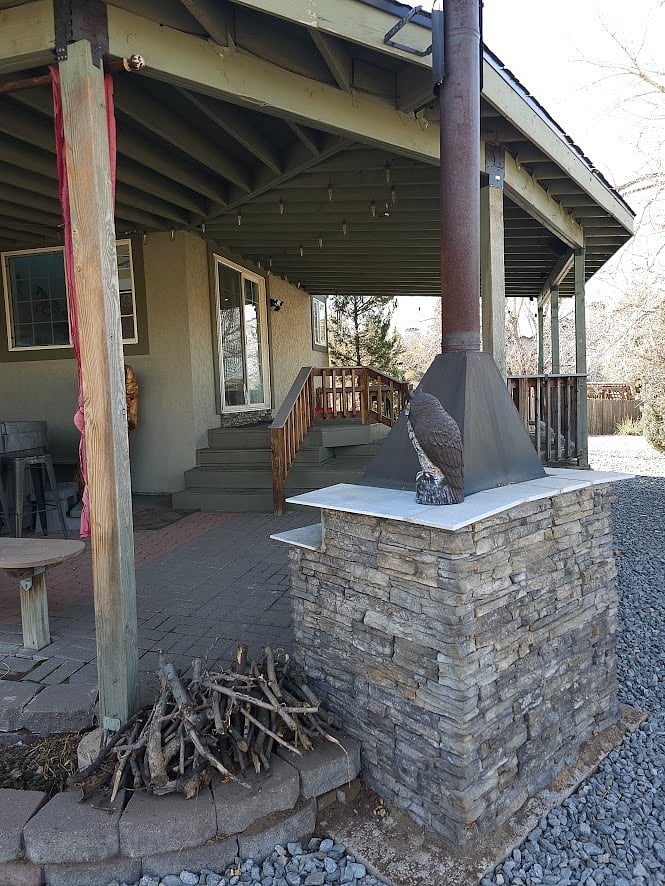 Outdoor fireplace on covered patio