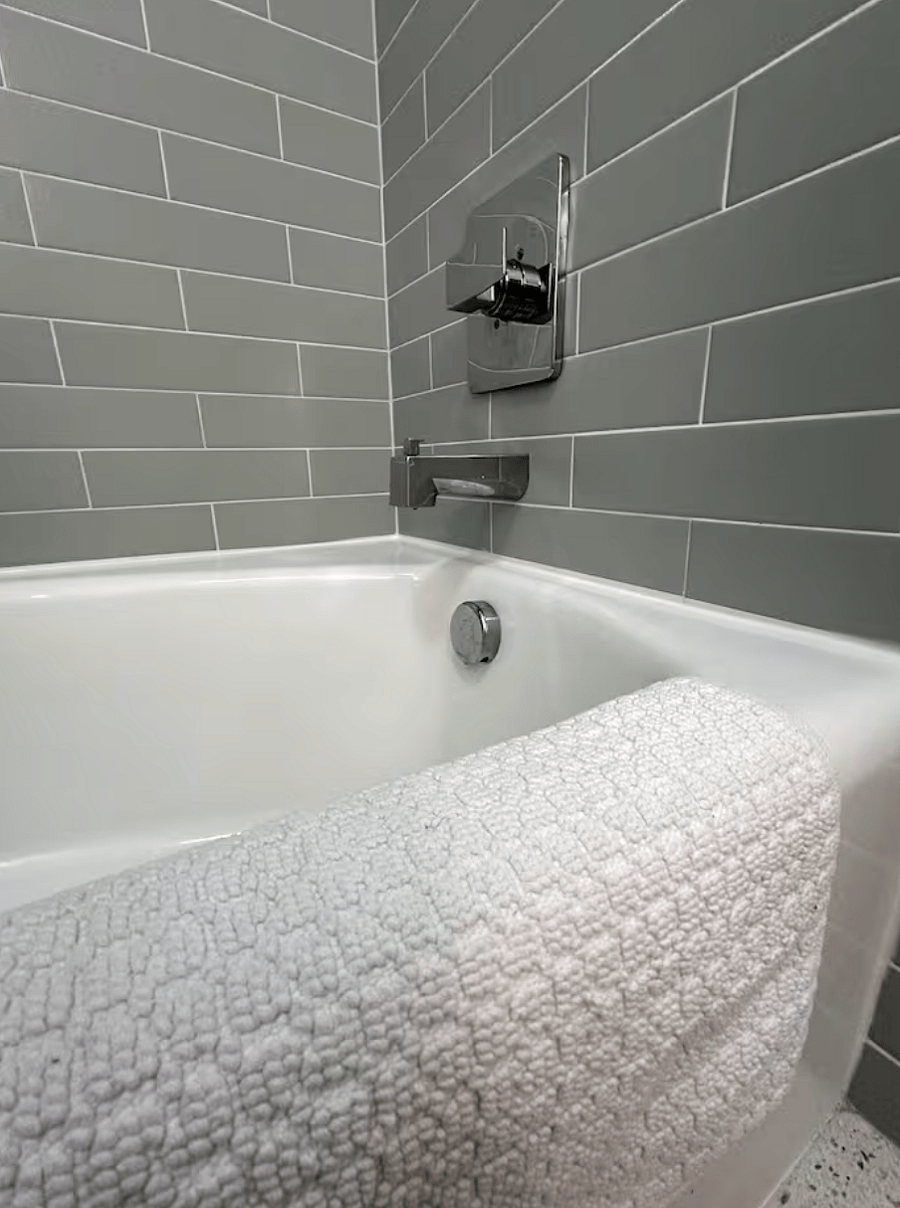 Secondary bathroom tub