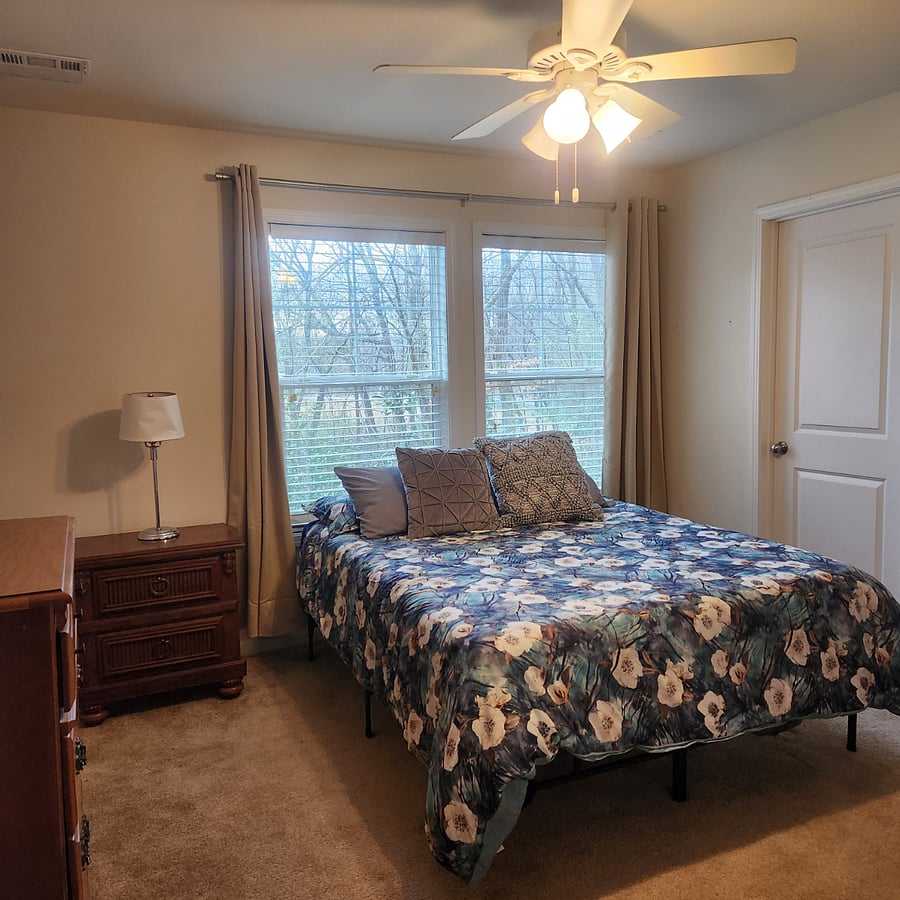 Second bedroom w/walk-in closet. Has 1 dresser and a large screen tv with Roku service.