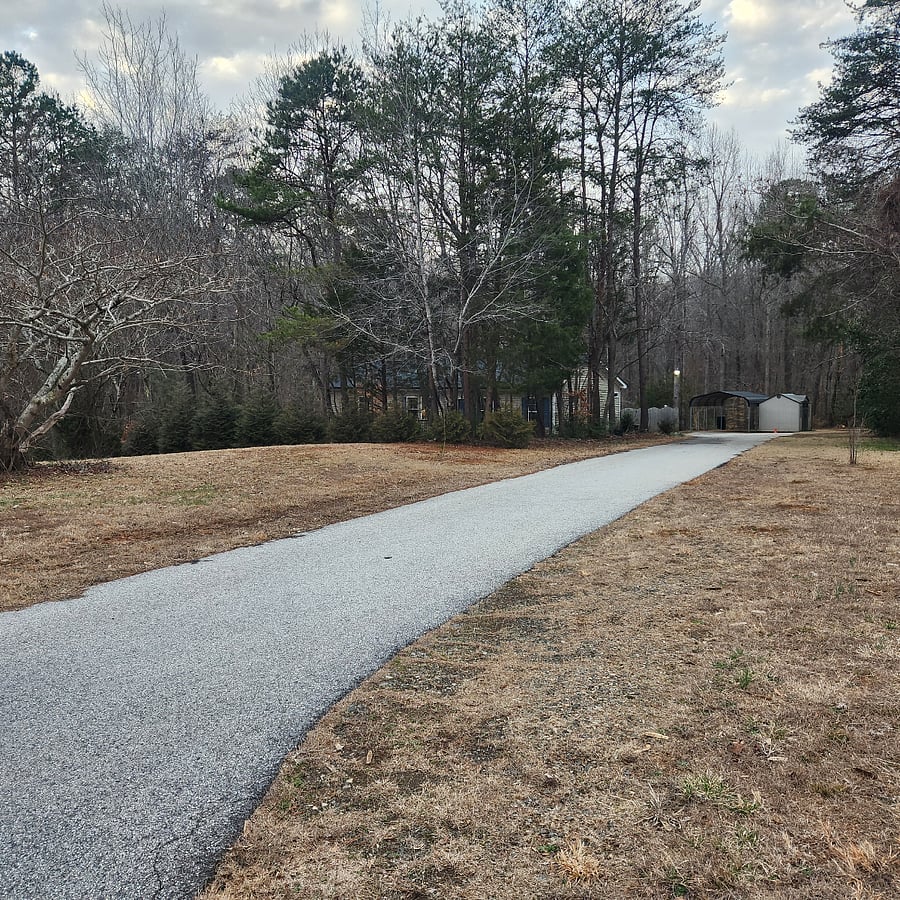 View of house, driveway and carport.
