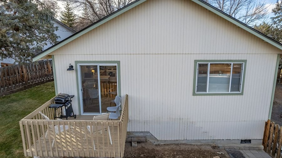 Back deck off the kitchen has a BBQ and room for a few chairs.