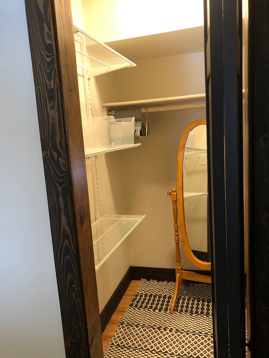 1st queen suite with walk in closet and shelves for clothes storage.