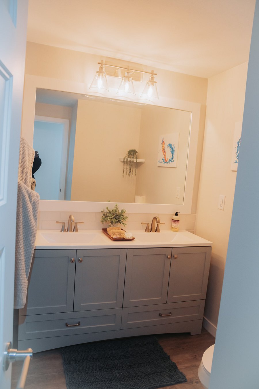The shared hallway bath is large with a double vanity for tons of extra storage.