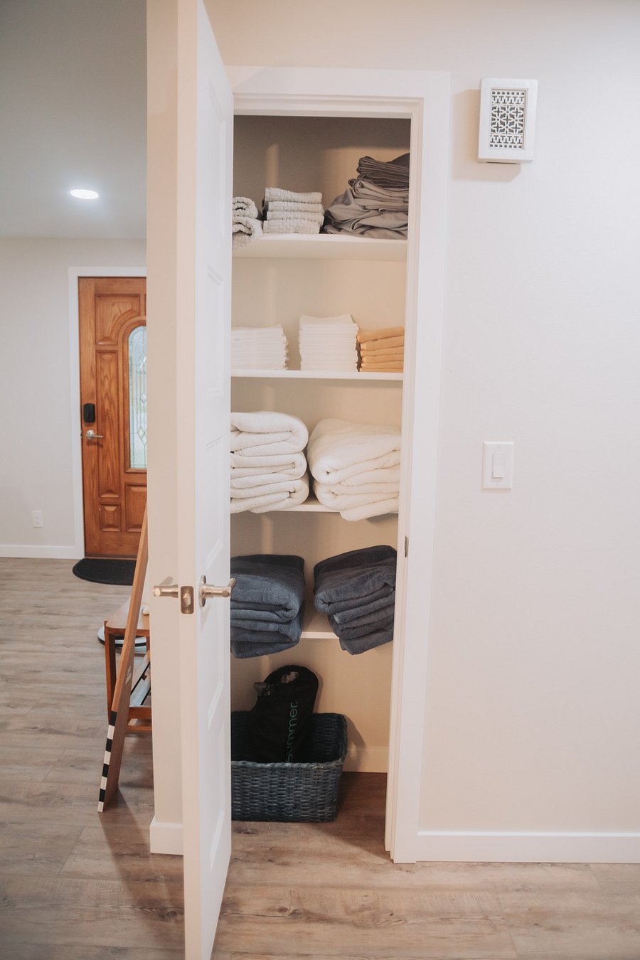 The amply stocked linen closet with extra bed linens and towels