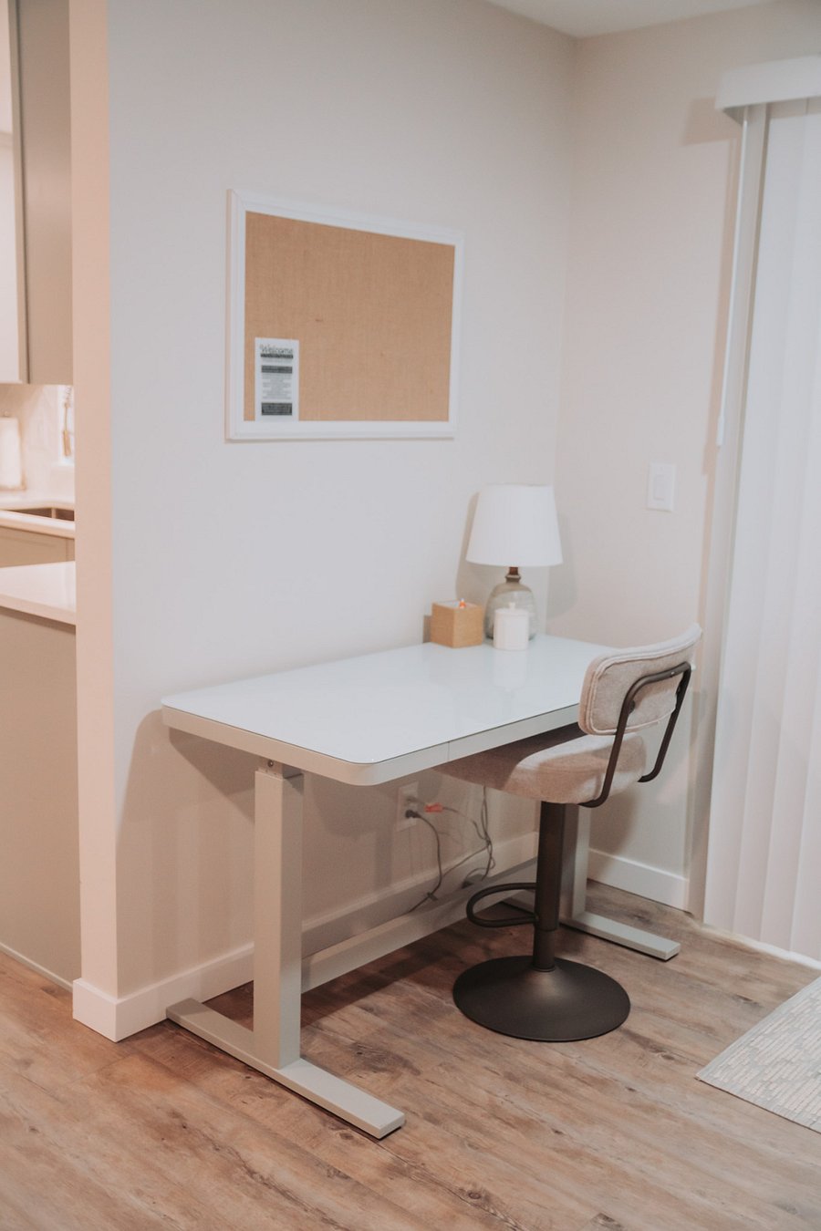 This convenient workspace has extra lighting, an outside view, and an ergonomic adjustable chair and desk.