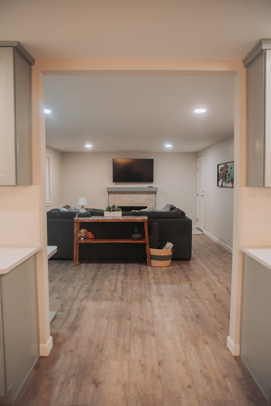 Off the other side of the kitchen lies the fireside living area, laundry area and access to the garage and back yard.